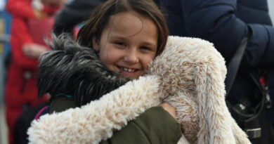 On 25 March 2022, 7-year-old Nastja hugs her favorite toy, a big teddy rabbit at Medyka border (Poland) after fleeing conflict from Ukraine. She arrived here with her family from Poltava - two hours away from Kharkiv.