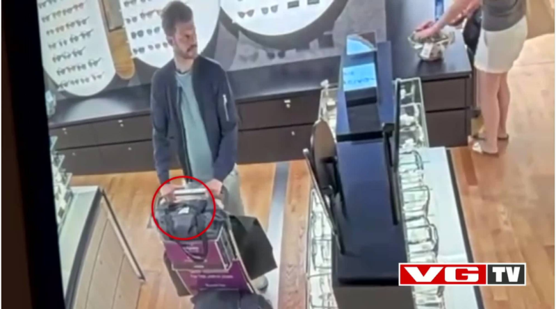 Zrzut z ekranu z nagrania monitoringu, pokazujący mężczyznę w sklepie z okularami